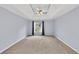 Large bedroom featuring neutral carpet, a ceiling fan, and natural light from the window at 1350 Rivershyre Pkwy, Lawrenceville, GA 30043