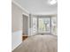 Bay window dining area with neutral carpet and paint colors and an adjacent doorway at 1350 Rivershyre Pkwy, Lawrenceville, GA 30043