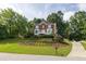 Charming home featuring a well-manicured front lawn and inviting entrance at 1350 Rivershyre Pkwy, Lawrenceville, GA 30043