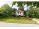 Charming two-story brick home with landscaped front yard and inviting entrance steps at 1350 Rivershyre Pkwy, Lawrenceville, GA 30043