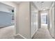Hallway featuring access to carpeted bedrooms with lots of natural light at 1350 Rivershyre Pkwy, Lawrenceville, GA 30043
