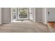 Bright living room featuring large bay windows with backyard views at 1350 Rivershyre Pkwy, Lawrenceville, GA 30043