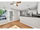 Open floor plan showcasing hardwood floors and a view of the kitchen with black granite countertops at 1350 Rivershyre Pkwy, Lawrenceville, GA 30043