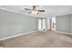 Large living room featuring carpet flooring, neutral walls and multiple entry points at 1350 Rivershyre Pkwy, Lawrenceville, GA 30043