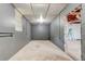 Unfinished basement with concrete walls, floors, and ceiling, offering a blank canvas for customization at 1848 Winthrop Se Dr, Atlanta, GA 30316