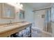 Bathroom featuring double sinks, granite countertop, and a shower and tub combo at 1848 Winthrop Se Dr, Atlanta, GA 30316