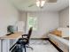 This bedroom functions as a flex space with a desk, futon, and mounted television at 1848 Winthrop Se Dr, Atlanta, GA 30316