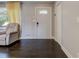 Inviting foyer featuring dark hardwood floors, a stylish front door, and neutral wall colors at 1848 Winthrop Se Dr, Atlanta, GA 30316