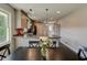 Bright kitchen with pendant lighting, granite countertops, and modern appliances next to the eating area at 1848 Winthrop Se Dr, Atlanta, GA 30316