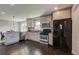Bright kitchen features granite countertops, stainless appliances, and dark hardwood floors at 1848 Winthrop Se Dr, Atlanta, GA 30316