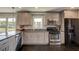 Modern kitchen with granite countertops, stainless steel appliances, and a view at 1848 Winthrop Se Dr, Atlanta, GA 30316