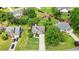Aerial view of a charming home with lush greenery, showcasing its curb appeal and neighborhood setting at 3635 Bardfield Ct, Cumming, GA 30041
