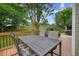 Back deck features an outdoor dining area overlooking the lovely lawn and backyard at 3635 Bardfield Ct, Cumming, GA 30041