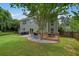 Well-manicured backyard with a patio and deck, perfect for outdoor dining and relaxation at 3635 Bardfield Ct, Cumming, GA 30041