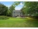 Picture of a green backyard featuring a cozy deck, ideal for relaxation or outdoor gatherings at 3635 Bardfield Ct, Cumming, GA 30041