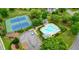 Aerial shot of the community pool and tennis courts, perfect for recreation and relaxation at 3635 Bardfield Ct, Cumming, GA 30041
