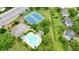 Overhead view of the community pool, tennis courts, and parking area at 3635 Bardfield Ct, Cumming, GA 30041