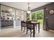 Dining area showcasing backyard views and an open floorplan to the living room at 3635 Bardfield Ct, Cumming, GA 30041