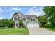 Charming two-story home with a well-manicured lawn and a two-car garage at 3635 Bardfield Ct, Cumming, GA 30041
