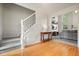 Welcoming foyer with hardwood floors, staircase, and open view to the cozy living room at 3635 Bardfield Ct, Cumming, GA 30041
