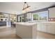 Bright eat-in kitchen features stainless steel appliances, white cabinets, and a center island at 3635 Bardfield Ct, Cumming, GA 30041