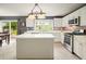 Bright eat-in kitchen features stainless steel appliances, white cabinets, and a center island at 3635 Bardfield Ct, Cumming, GA 30041