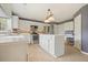Bright eat-in kitchen features stainless steel appliances, white cabinets, and a center island at 3635 Bardfield Ct, Cumming, GA 30041