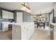 Bright eat-in kitchen features stainless steel appliances, white cabinets, and a center island at 3635 Bardfield Ct, Cumming, GA 30041