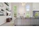Spacious living room featuring soaring ceilings, a cozy fireplace, and tons of natural light at 3635 Bardfield Ct, Cumming, GA 30041