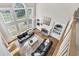 Bright, open living room with high ceilings and large windows overlooking a lake at 870 Longstone Lndg, Alpharetta, GA 30022