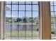 Stunning water view from a large window, framed by elegant trim at 870 Longstone Lndg, Alpharetta, GA 30022