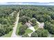 Aerial view of home with circular driveway and large, wooded lot at 1720 Monarch Ct, Cumming, GA 30041