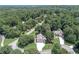 Aerial view of home on large, wooded lot in a peaceful neighborhood at 1720 Monarch Ct, Cumming, GA 30041