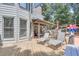 Inviting backyard deck with lounge chairs, dining area, and serene views of the surrounding greenery at 1720 Monarch Ct, Cumming, GA 30041