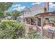 Spacious backyard with a large deck, covered patio, lush greenery, and plenty of room for recreation at 1720 Monarch Ct, Cumming, GA 30041