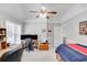 Bright bedroom with a ceiling fan, desk area, and neutral décor at 1720 Monarch Ct, Cumming, GA 30041