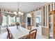 Dining room featuring large windows with decorative curtains at 1720 Monarch Ct, Cumming, GA 30041