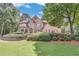 Beautiful brick home with manicured landscaping, offering a welcoming and picturesque setting at 1720 Monarch Ct, Cumming, GA 30041