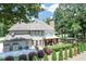 Inviting backyard boasting a covered deck, lush landscaping, and a serene outdoor space for relaxing or entertaining guests at 1720 Monarch Ct, Cumming, GA 30041