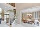 Foyer featuring an open staircase, dining room and views of the upper level, creating an inviting entryway at 1720 Monarch Ct, Cumming, GA 30041