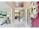 Bright foyer with high ceilings, staircase, and open views of living and dining areas at 1720 Monarch Ct, Cumming, GA 30041