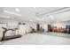 Expansive garage with work space, exercise equipment, and ample storage at 1720 Monarch Ct, Cumming, GA 30041