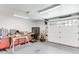 Well-lit garage space with workbench and garage door at 1720 Monarch Ct, Cumming, GA 30041