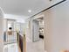 Upstairs hallway showcasing neutral walls, crown molding and an open railing at 1720 Monarch Ct, Cumming, GA 30041