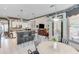 Open kitchen with breakfast bar, stainless appliances and adjacent living area is perfect for entertaining in this lovely home at 1720 Monarch Ct, Cumming, GA 30041