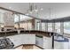 Well-lit kitchen boasting granite counters, modern appliances, a breakfast nook, and an open floor plan at 1720 Monarch Ct, Cumming, GA 30041