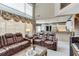 Inviting living room with fireplace and views of kitchen and balcony area at 1720 Monarch Ct, Cumming, GA 30041