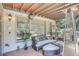 Relaxing covered patio with stylish furniture, perfect for outdoor entertaining and enjoying the serene surroundings at 1720 Monarch Ct, Cumming, GA 30041