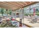 Entertainer's dream: an expansive patio with seating, grill, outdoor bar, and views of lush landscaping at 1720 Monarch Ct, Cumming, GA 30041