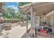 Covered patio with stylish furniture, grill, and an outdoor heater for enjoyable outdoor entertaining at 1720 Monarch Ct, Cumming, GA 30041